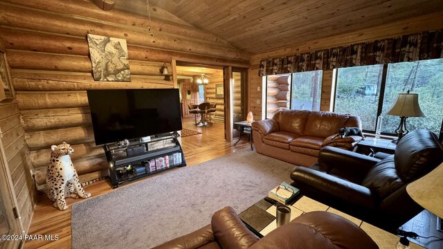 living room with light hardwood / wood-style flooring, vaulted ceiling, and wooden ceiling