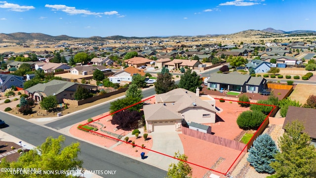 birds eye view of property featuring a mountain view