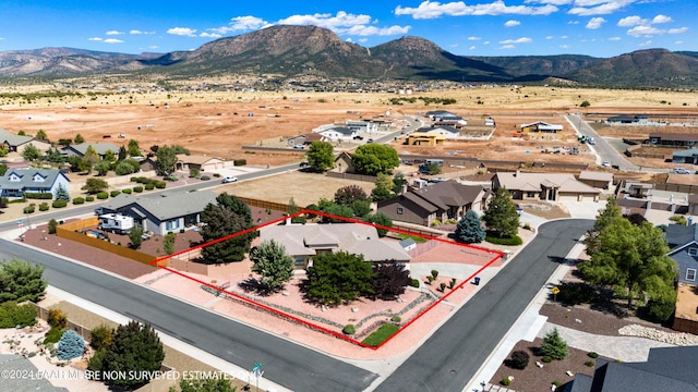 birds eye view of property with a mountain view