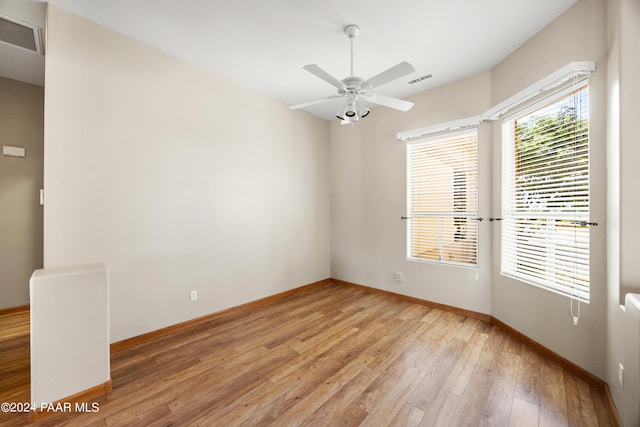 spare room with ceiling fan and light hardwood / wood-style flooring