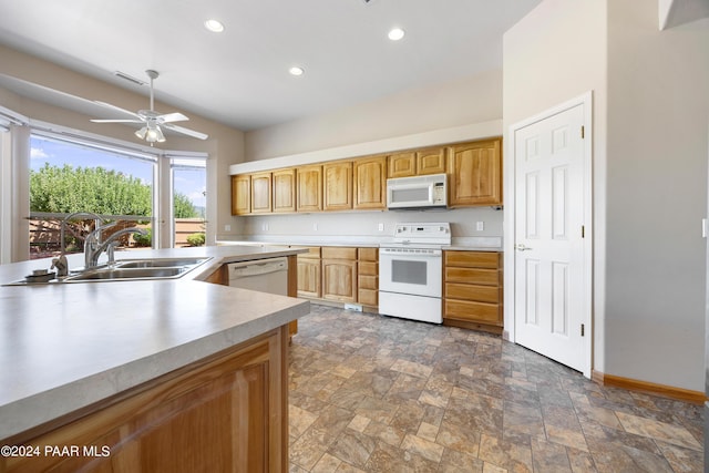 kitchen featuring white appliances, vaulted ceiling, ceiling fan, and sink