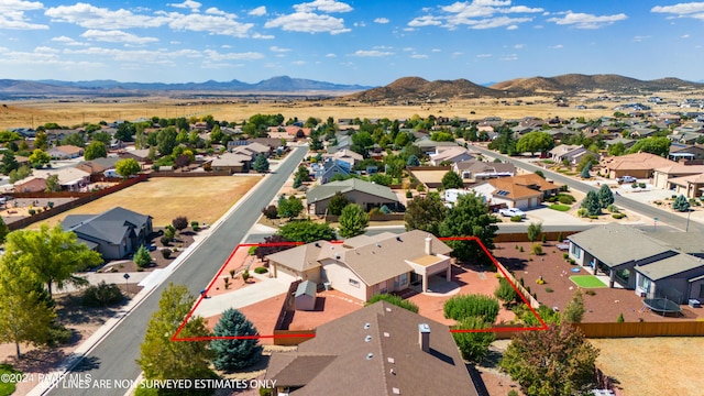 drone / aerial view featuring a mountain view