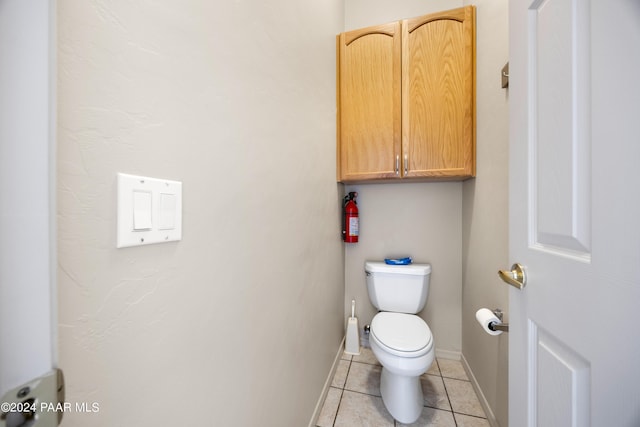 bathroom with tile patterned floors and toilet