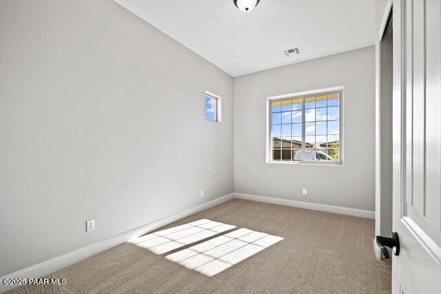 7064 N Robin Nest Ct, Prescott Valley, AZ 86315 - carpeted empty room featuring baseboards