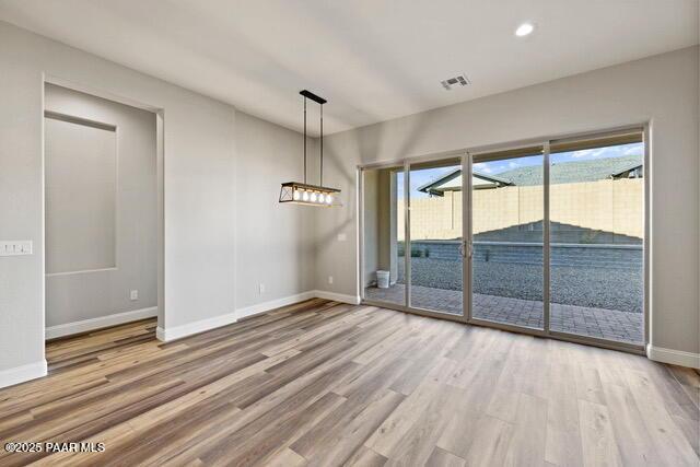 7064 N Robin Nest Ct, Prescott Valley, AZ 86315 - unfurnished dining area with wood finished floors and recessed lighting