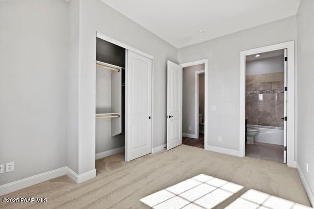 7064 N Robin Nest Ct, Prescott Valley, AZ 86315 - unfurnished bedroom with carpet floors, a closet, and ensuite bathroom
