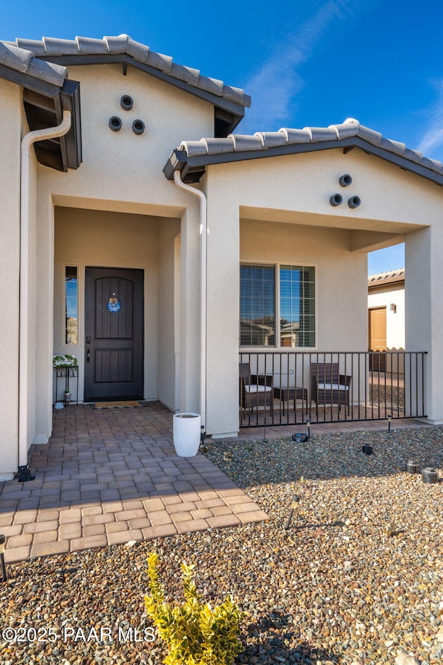 7064 N Robin Nest Ct, Prescott Valley, AZ 86315 - property entrance featuring stucco siding and a tile roof