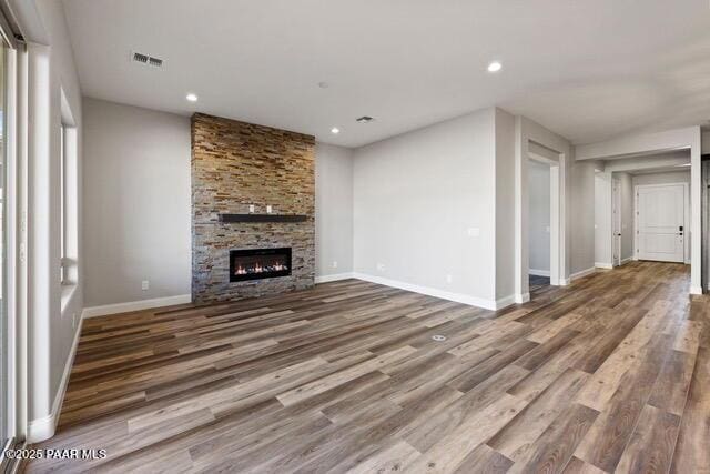 7064 N Robin Nest Ct, Prescott Valley, AZ 86315 - unfurnished living room featuring wood finished floors, a fireplace, and recessed lighting