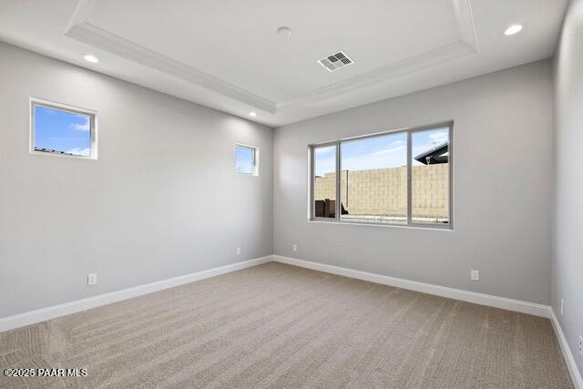 7064 N Robin Nest Ct, Prescott Valley, AZ 86315 - empty room with a raised ceiling, recessed lighting, and carpet flooring