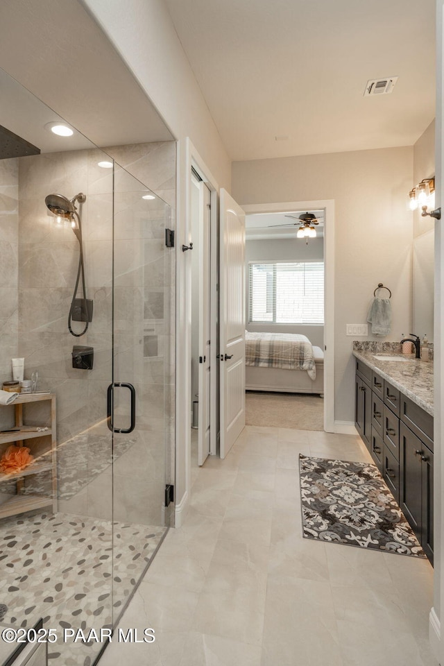 7064 N Robin Nest Ct, Prescott Valley, AZ 86315 - bathroom with connected bathroom, vanity, a shower stall, ceiling fan, and recessed lighting