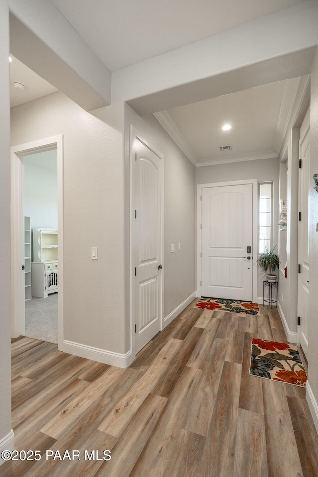 7064 N Robin Nest Ct, Prescott Valley, AZ 86315 - foyer entrance featuring wood finished floors and crown molding