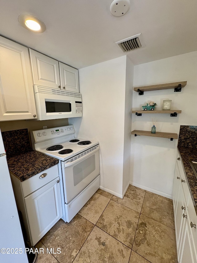 kitchen featuring light tile patterned floors, white appliances, white cabinets, and visible vents