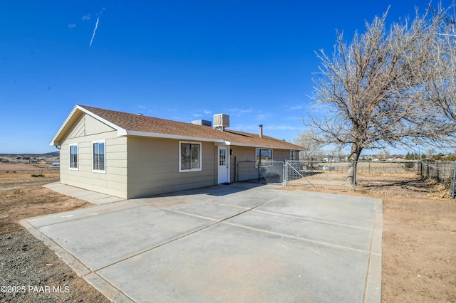 ranch-style home featuring central air condition unit