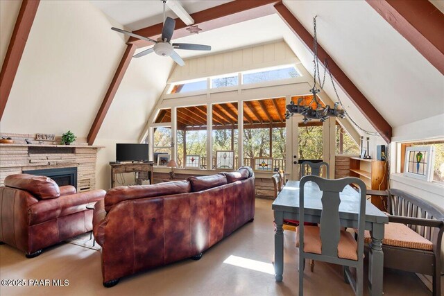 2308 W Mountain Laurel Rd, Prescott, AZ 86303 - living area with vaulted ceiling with beams, finished concrete flooring, a fireplace, french doors, and a ceiling fan