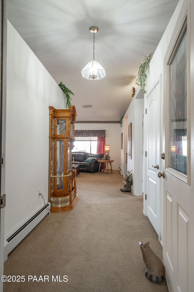 14705 E State Route 169, Dewey-Humboldt, AZ 86327 - corridor featuring a baseboard heating unit and carpet floors