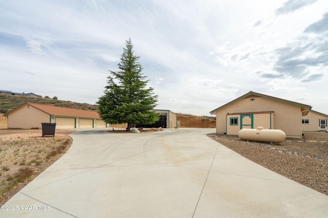 14705 E State Route 169, Dewey-Humboldt, AZ 86327 - ranch-style house featuring an outdoor structure, stucco siding, and a garage