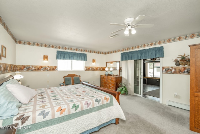 14705 E State Route 169, Dewey-Humboldt, AZ 86327 - bedroom featuring a baseboard heating unit, carpet, access to exterior, and a ceiling fan