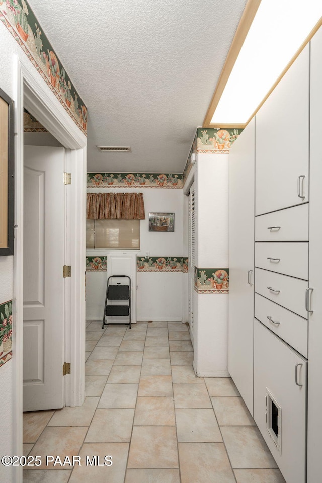14705 E State Route 169, Dewey-Humboldt, AZ 86327 - kitchen with a textured ceiling and white cabinets