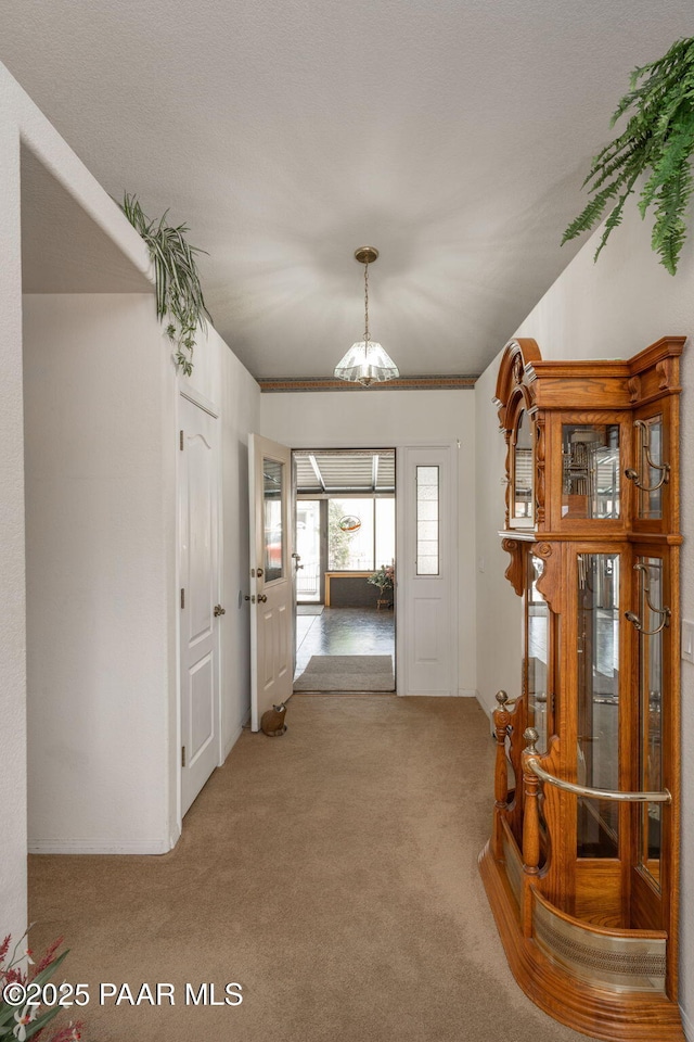 14705 E State Route 169, Dewey-Humboldt, AZ 86327 - hallway with a chandelier and carpet flooring
