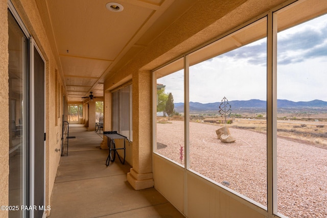 14705 E State Route 169, Dewey-Humboldt, AZ 86327 - unfurnished sunroom featuring a mountain view and a ceiling fan
