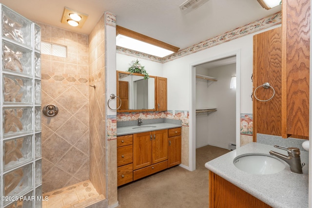 14705 E State Route 169, Dewey-Humboldt, AZ 86327 - full bath featuring walk in shower, two vanities, baseboard heating, and a spacious closet