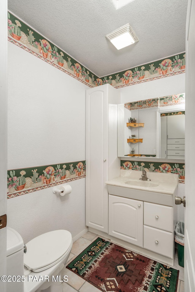 14705 E State Route 169, Dewey-Humboldt, AZ 86327 - half bathroom with toilet, a textured ceiling, tile patterned floors, and vanity