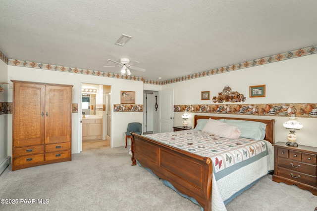 14705 E State Route 169, Dewey-Humboldt, AZ 86327 - bedroom with light colored carpet, a textured ceiling, ensuite bathroom, and a ceiling fan