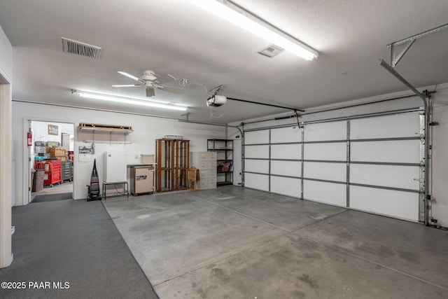 14705 E State Route 169, Dewey-Humboldt, AZ 86327 - garage featuring a garage door opener and ceiling fan