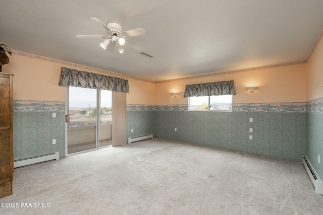 14705 E State Route 169, Dewey-Humboldt, AZ 86327 - spare room with a baseboard heating unit, wainscoting, and plenty of natural light