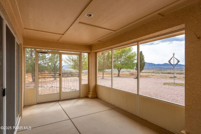 14705 E State Route 169, Dewey-Humboldt, AZ 86327 - unfurnished sunroom featuring a mountain view and tile patterned flooring