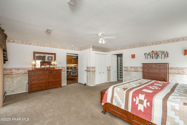 14705 E State Route 169, Dewey-Humboldt, AZ 86327 - bedroom featuring carpet flooring, a wainscoted wall, a textured ceiling, and a ceiling fan