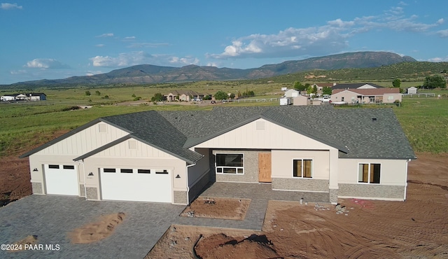 exterior space featuring a garage and a mountain view