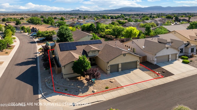 bird's eye view with a residential view and a mountain view