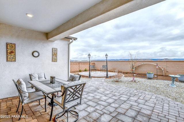 view of patio / terrace featuring outdoor dining area and a fenced backyard