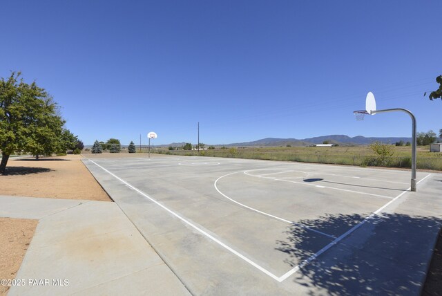 view of sport court featuring community basketball court and a mountain view