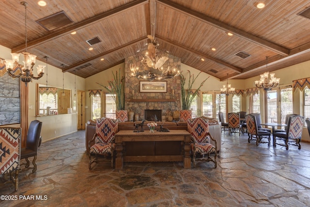 living area featuring an inviting chandelier, wooden ceiling, and stone tile floors