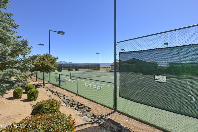 view of sport court with fence