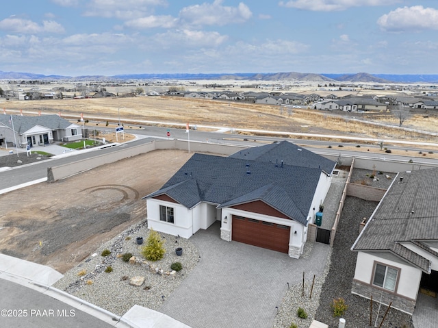 drone / aerial view featuring a mountain view and a residential view