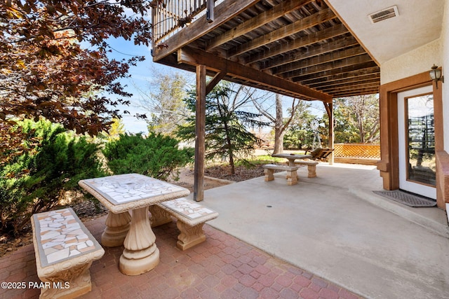 view of patio featuring visible vents