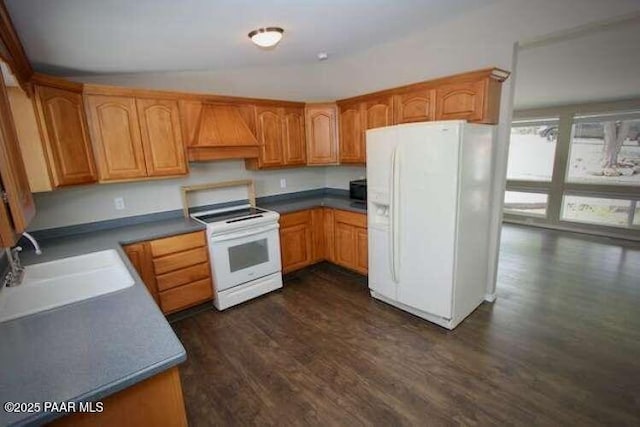 487 Stewart Cir, Prescott, AZ 86301 - kitchen with white appliances, custom range hood, dark wood-style flooring, a sink, and vaulted ceiling