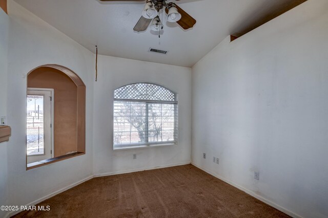 9100 E Lonesome Valley Rd, Prescott Valley, AZ 86315 - carpeted spare room with arched walkways, a ceiling fan, visible vents, and plenty of natural light