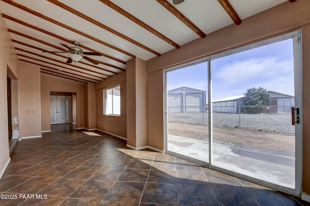 9100 E Lonesome Valley Rd, Prescott Valley, AZ 86315 - spare room featuring ceiling fan, vaulted ceiling with beams, and baseboards