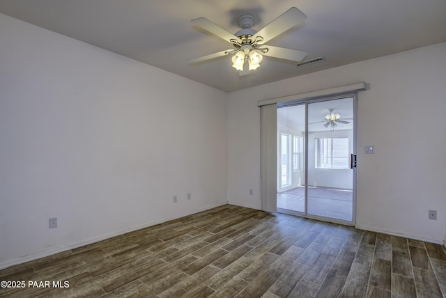 9100 E Lonesome Valley Rd, Prescott Valley, AZ 86315 - unfurnished room with visible vents, a ceiling fan, and dark wood-style floors