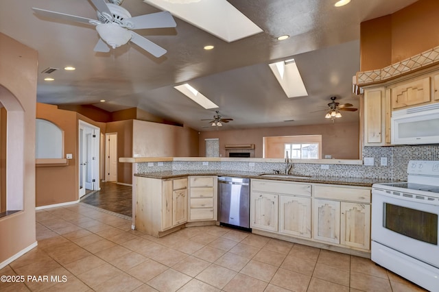 9100 E Lonesome Valley Rd, Prescott Valley, AZ 86315 - kitchen featuring white appliances, a peninsula, light tile patterned flooring, ceiling fan, and a sink