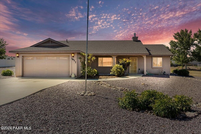 single story home featuring a garage