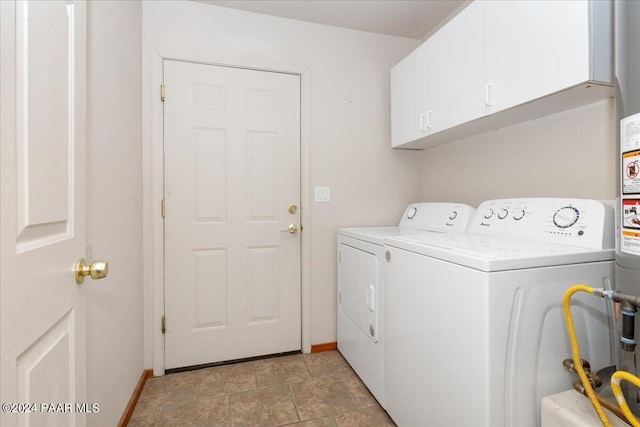 laundry room with cabinets and washing machine and dryer