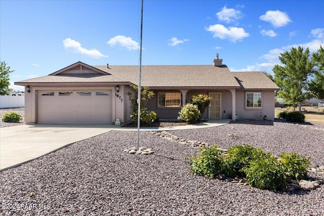 ranch-style home with a garage