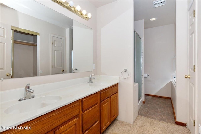 bathroom with vanity and separate shower and tub