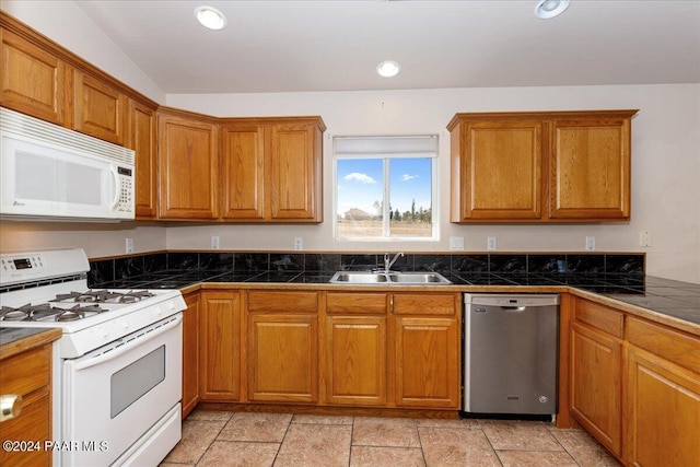 kitchen with white appliances and sink