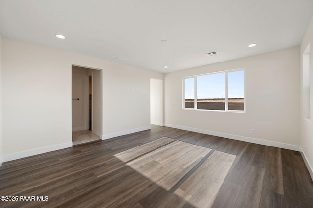 empty room featuring dark wood-type flooring